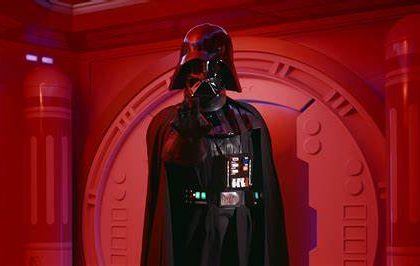 Darth Vader ready to meet guets inside with a spaceship style background