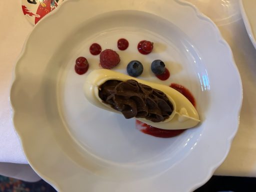 A white chocolate shoe filled with chocolate mouse