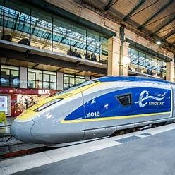 Image of a blue yellow and grey eurostar train at a station platform