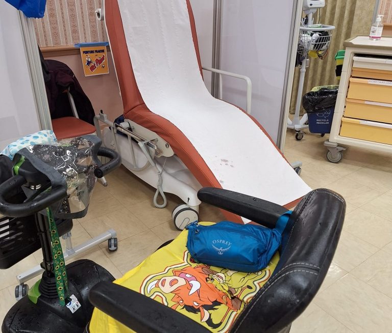 Image of mobility scooter by a medical reclining bed