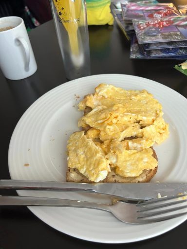 Image of some scrambled eggs on brown toast