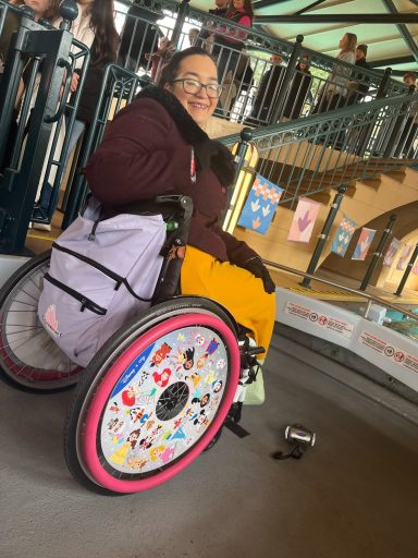 A wheelchair secured in place with straps to the underside of the chair