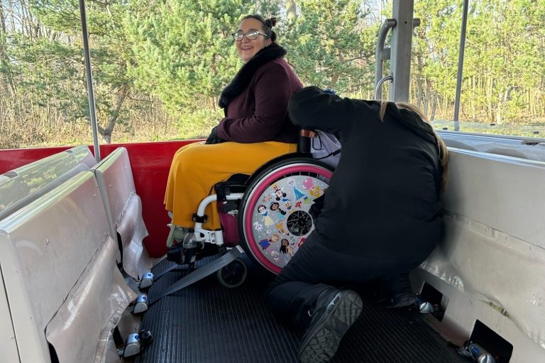 Image of guest in a wheelchair seated on board