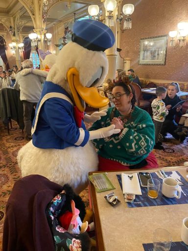 Donald duck is holding my hand