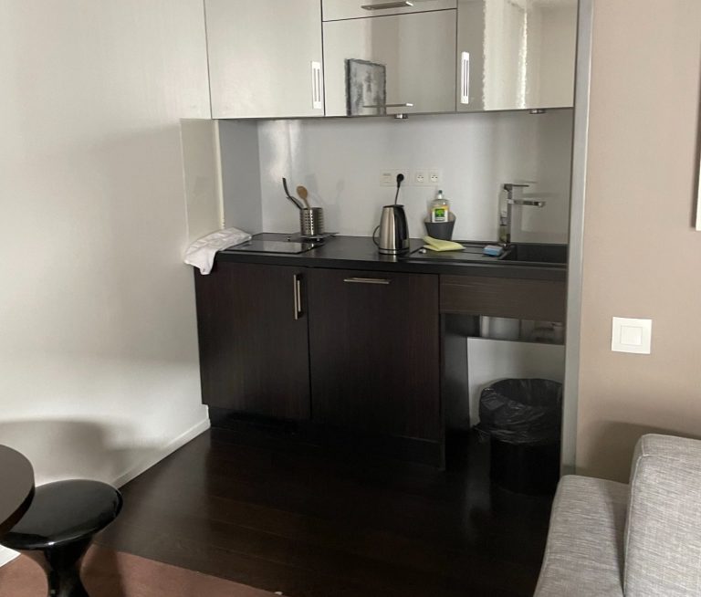 Image of Kitchen area with sink, kettle and hob