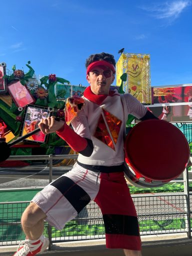 A drummer dressed in red and white