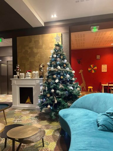 Image of a Christmas tree and a blue sofa