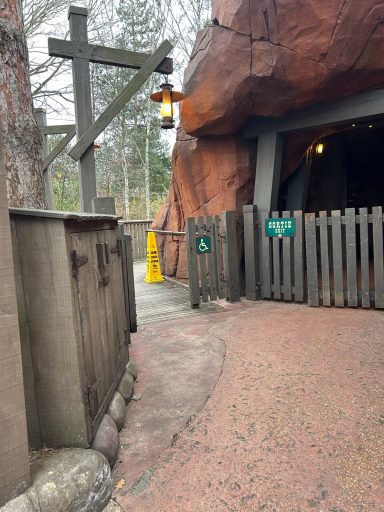 red concrete flooring with a wooden fence either side