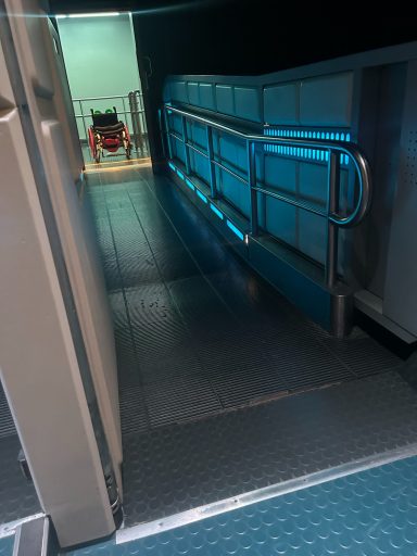 Wheelchair at end of loading ramp