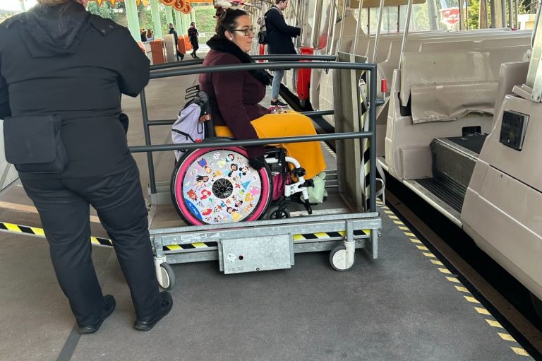 Image shows there is a wheelchair lift to allow a wheelchair user to board