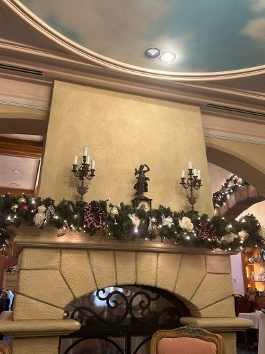 Green garlands above a stone fireplace