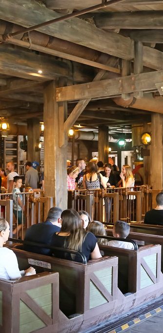 Iage shows the ride vehicles for big thunder mountain as they are being loaded