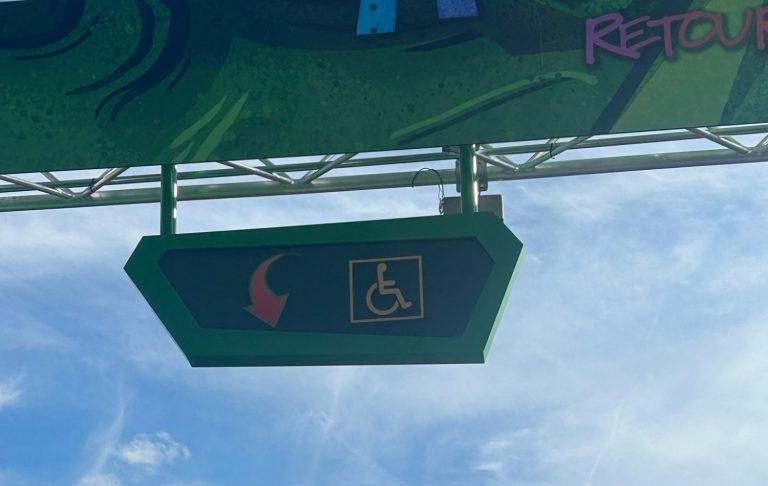 an image showing the overhead sign at the entrance to the accessible queue