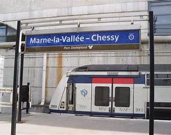 Image shows a RER train at the station platform of Marbe la vallee chessy