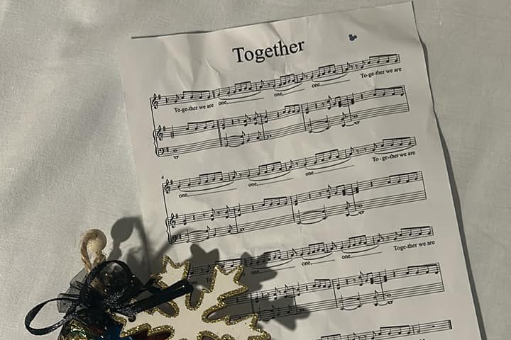 The image shows a piece of sheet music with Together written at the top