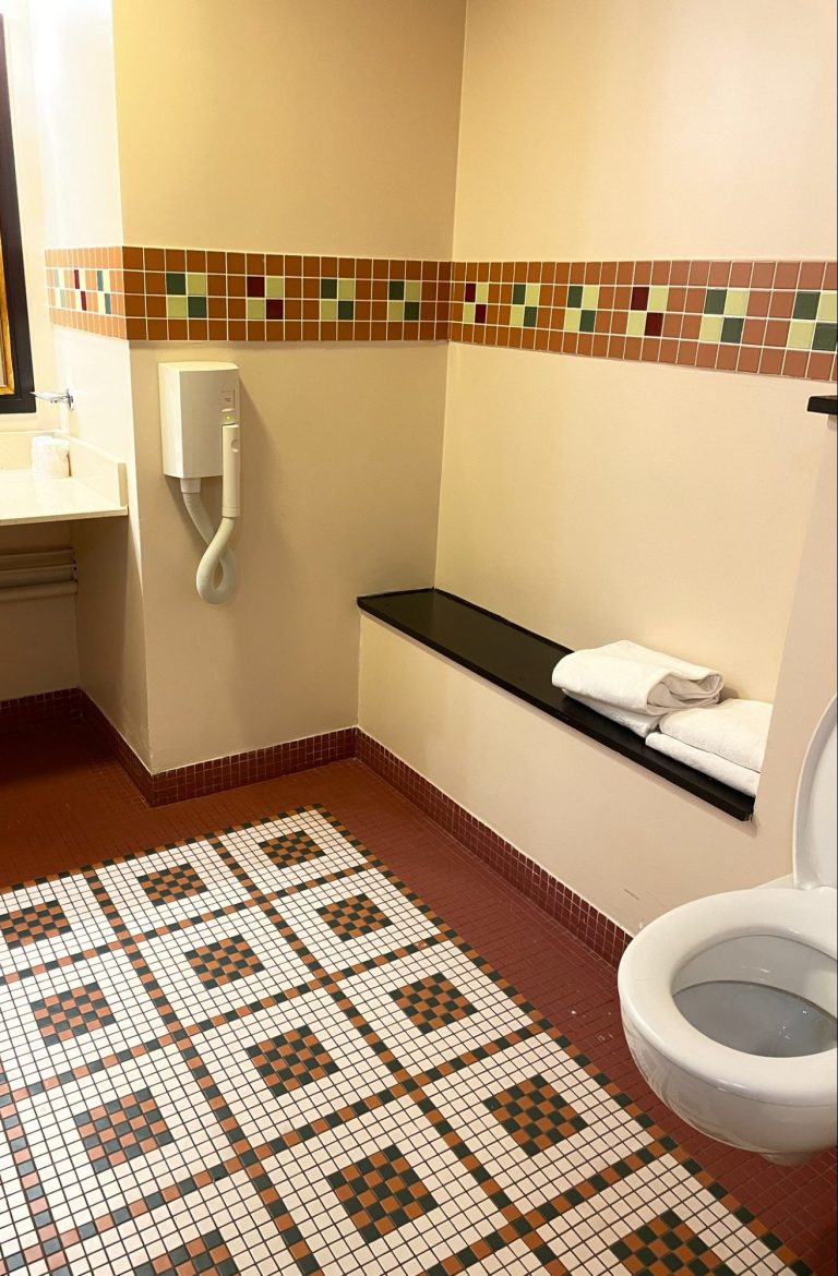 Image of an area of the wetroom showing a bench and a toilet 