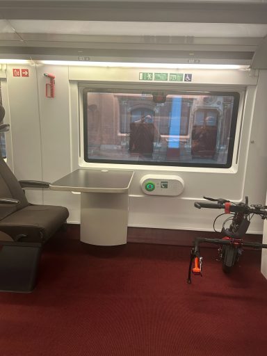 Image showing the wheelchair space on the e320 trains, showing the companion seat facing the space, occupied here by my attachment