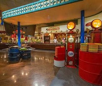 Image showing the buffet area in th ela cantina restaurant that is themed with oil drums and car items