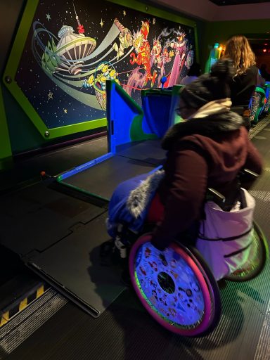 a wheelchair user is using the ramp to enter the ride vehicle