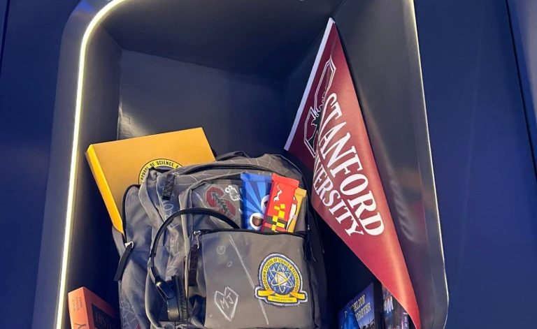 Peter parkers backpack and school supplies, including a school flag, displaced on a shelf