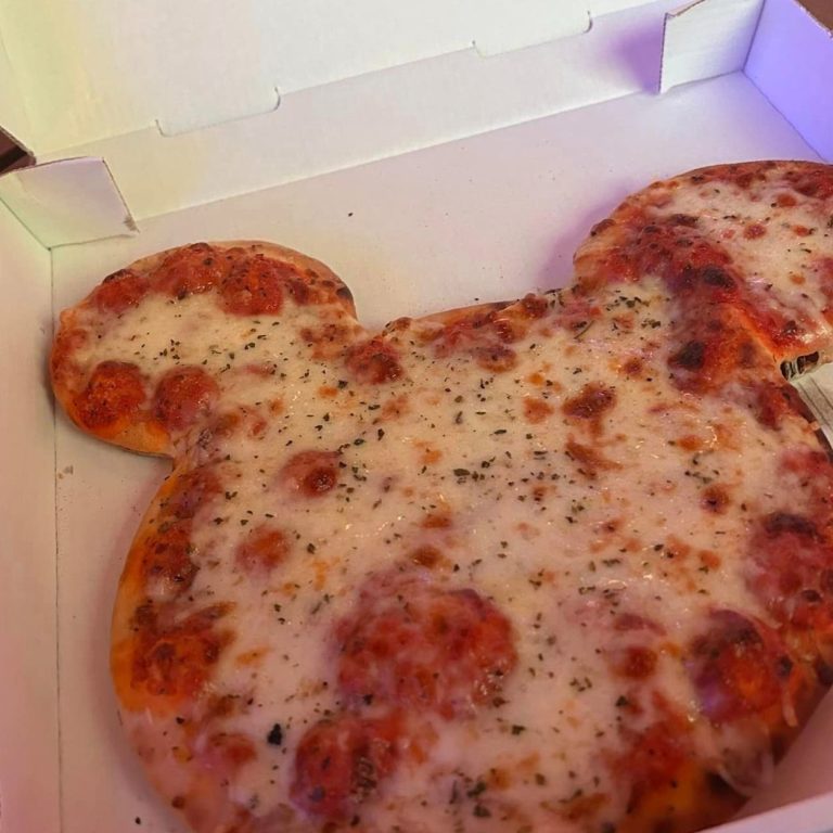 Image shows a cheese pizza which is mickey shaped