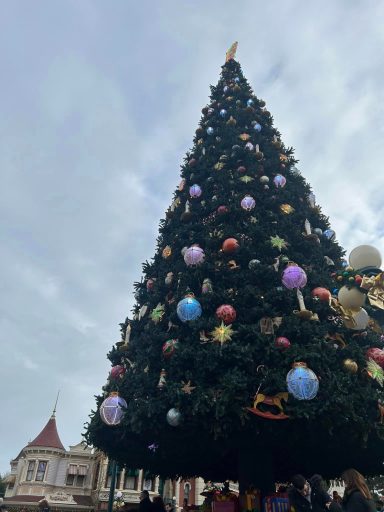 Close up of coloured ornaments on a christmas tree