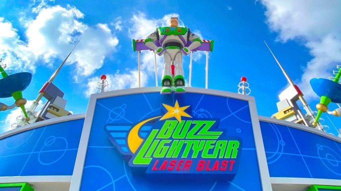 Image shows the entrance to the buzz lightyear ride which is blue with a large buzz model on top