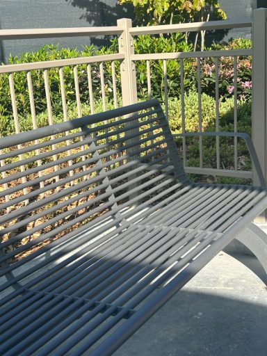 A silver metal bench