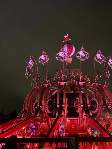 Dark image of the central section of the dumbo ride structure at night