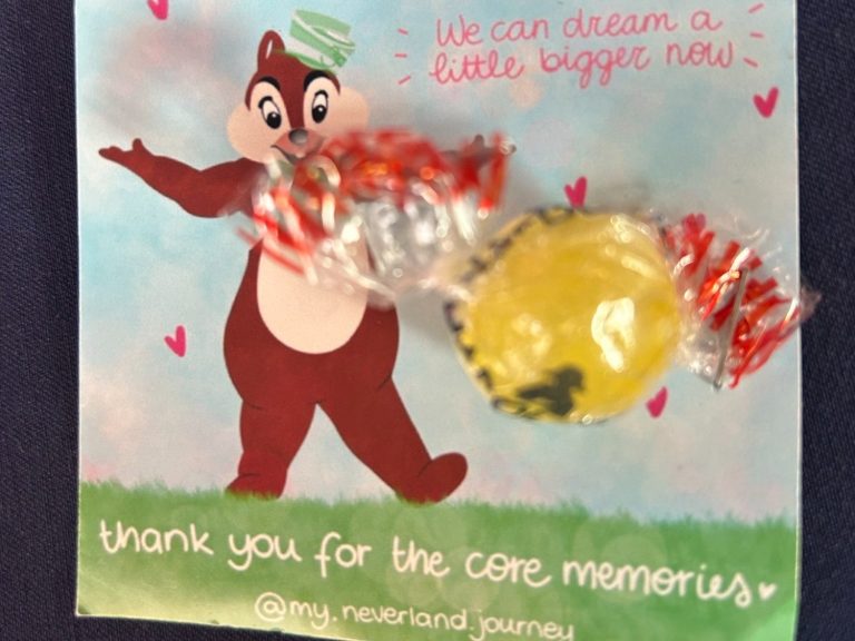 A card with an image of chip and a message saying thank you for the core memories and attached is a boiled sweet